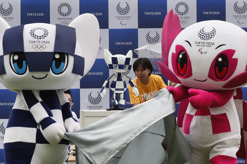 Tokyo 2020 Olympic mascot Miraitowa (left) and Tokyo 2020 Paralympic mascot Someity (right) unveil the Tokyo 2020 mascot robot Miraitowa at a ceremony to mark ‘One Year To Go Tokyo 2020’. Photo: EPA