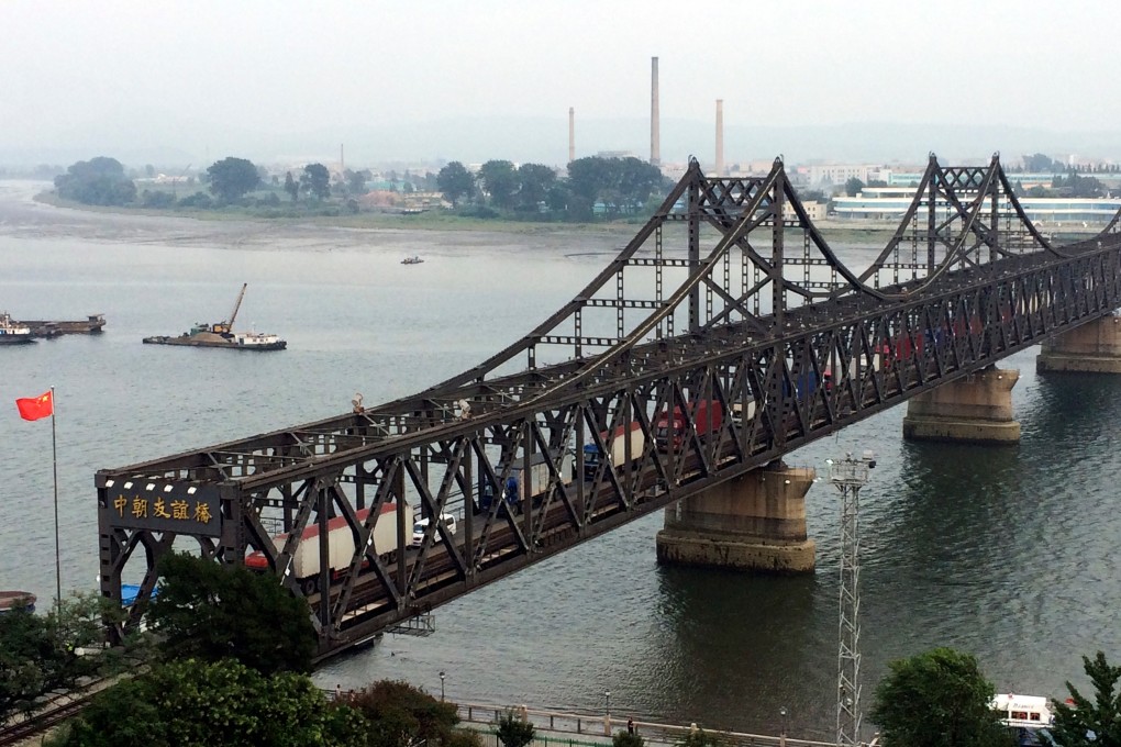 Trucks cross the bridge connecting China and North Korea in the Chinese border town of Dandong in 2017. Executives of a company based in Dandong have been charged with evading US sanctions by doing business in North Korea. Photo: AP