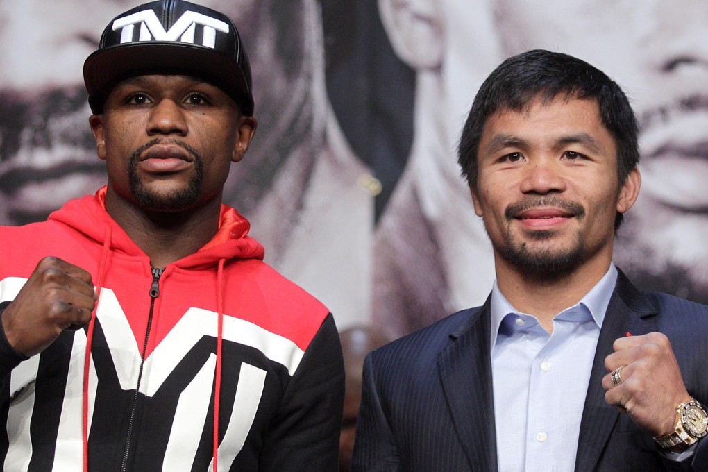 Floyd Mayweather and Manny Pacquiao pose before their 2015 fight. Photo: AFP