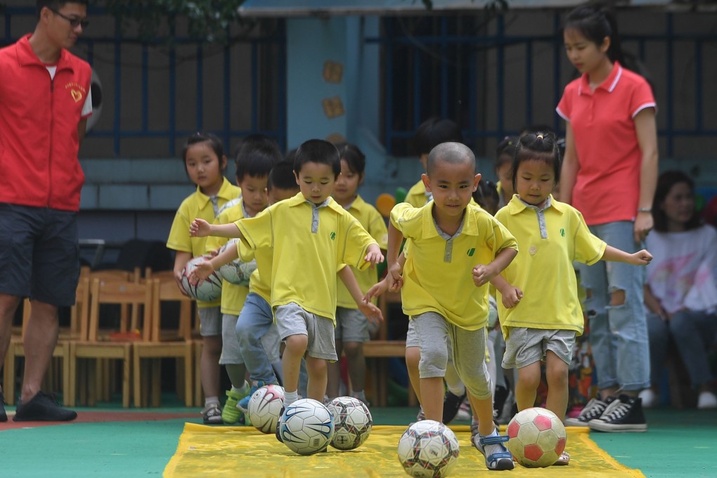 China is adding 3,000 kindergartens to its roster of schools where football will be encouraged among children. Photo: Xinhua