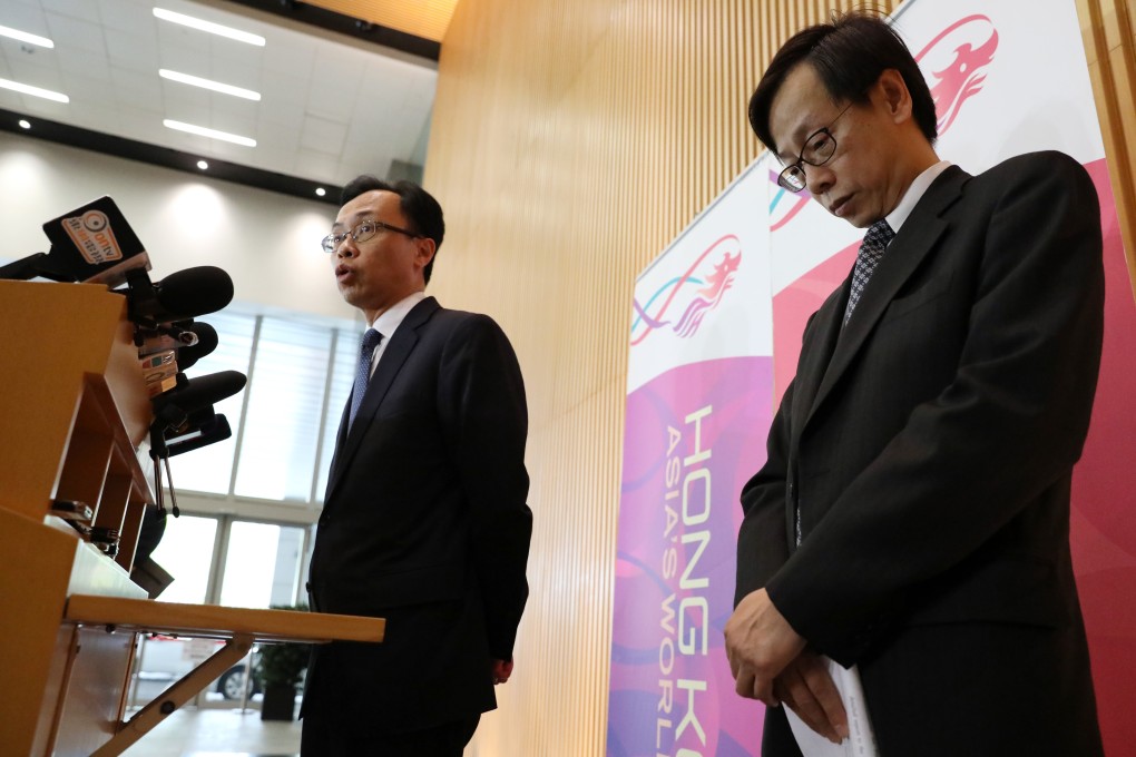 (Left to right) Secretary for Constitutional and Mainland Affairs Patrick Nip and Wong See-man, who was in charge of the Registration and Electoral Office (REO) at a press conference in April, where Wong denied knowing about the missing data. Photo: Nora Tam