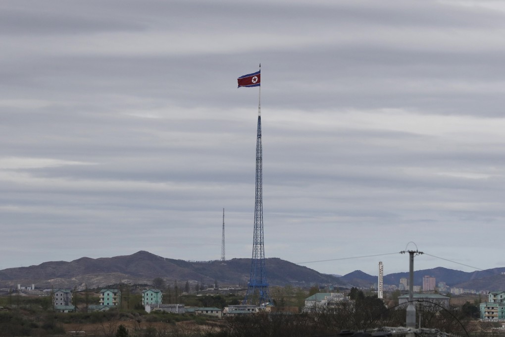 A North Korean flag seen atop a 160m tower in the North Korean village of Gijungdongseen. Photo: AP