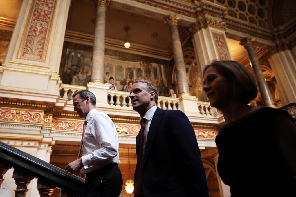 Britain’s newly appointed Foreign Secretary Dominic Raab (centre) arrives at the Foreign and Commonwealth buiding in London. Photo: AFP