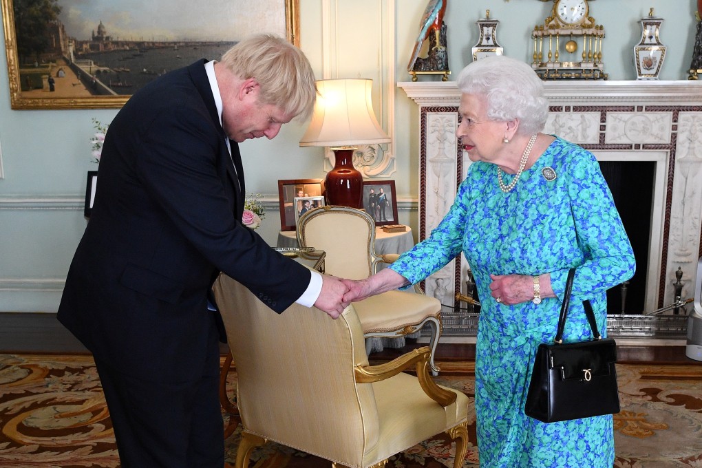 Queen Elizabeth welcomes Boris Johnson during an audience in Buckingham Palace. Photo: Reuters