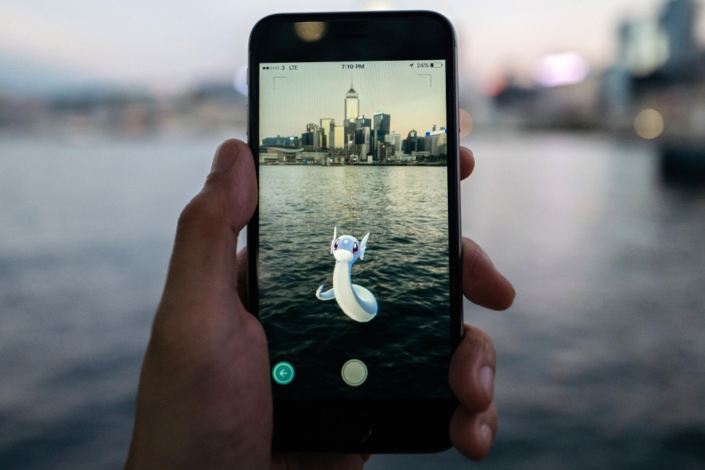 A Hong Kong Pokemon Go player finds a Dratini, a dragon type Pokemon, in Victoria Harbour. Photo: Bloomberg