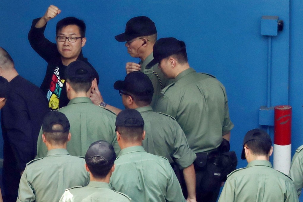 Raphael Wong being escorted to Lai Chi Kok Detention Centre in April this year. Photo: Robert Ng