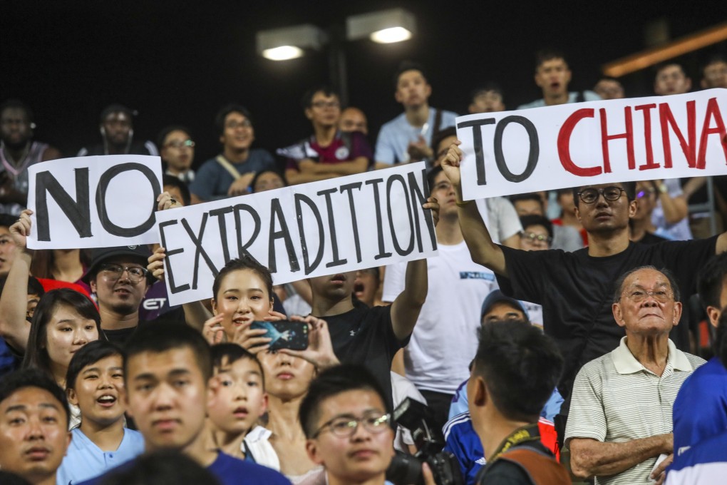 Protesters at the match between Kitchee and Manchester City at Hong Kong Stadium. Photo: K.Y. Cheng
