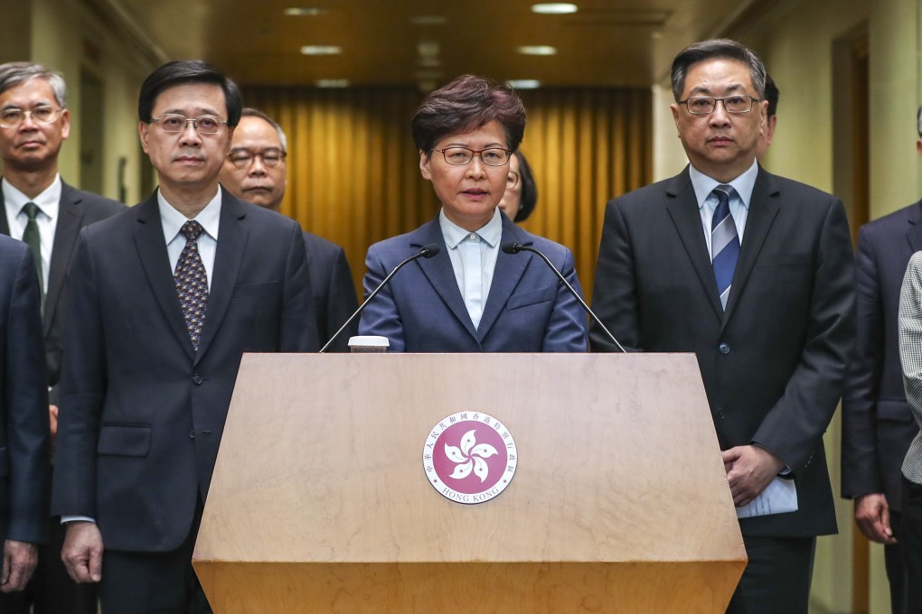 Chief Executive Carrie Lam, flanked by Secretary for Security John Lee Ka-chiu (left) and Commissioner of Police Stephen Lo (right), meet the media at the Chief Executive’s Office in Tamar, Admiralty, to respond to the extradition bill protest outside the liaison office in Sai Ying Pun and the violence at Yuen Long station on July 21. Photo: Robert Ng