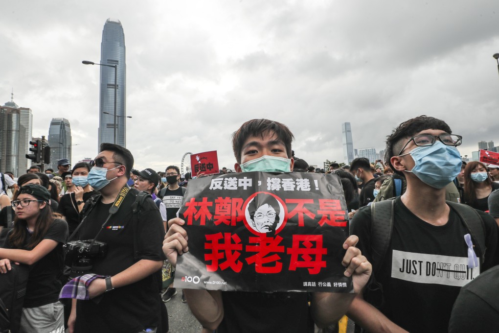 A protester holds up a sign reading “Carrie Lam is not my mother”, as people demonstrate against the extradition bill and call on the chief executive to resign, in Admiralty on June 17. Photo: Sam Tsang