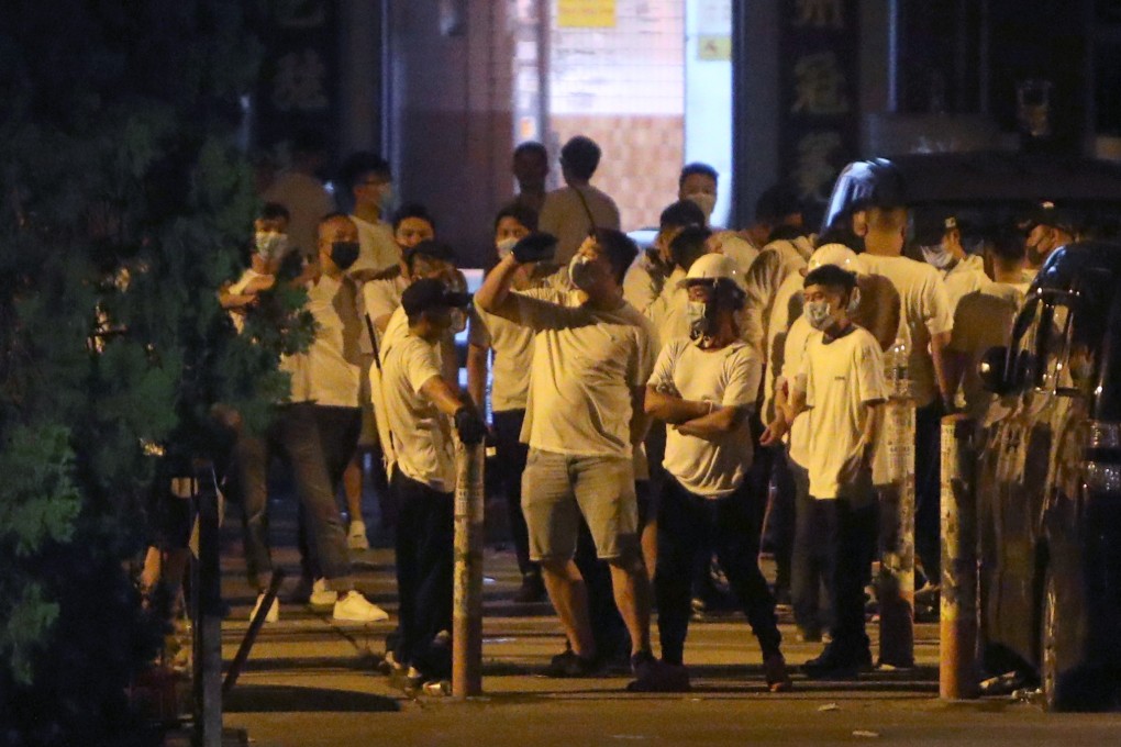 A mob of men in white on the streets of Yuen Long early Monday morning. Photo: Winson Wong