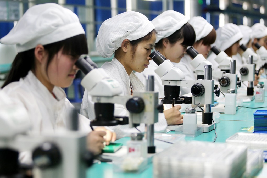 China is the leading maker of personal computers and smartphones globally, but it continues to rely heavily on imported components from the US and the rest of the world. Photo: EPA