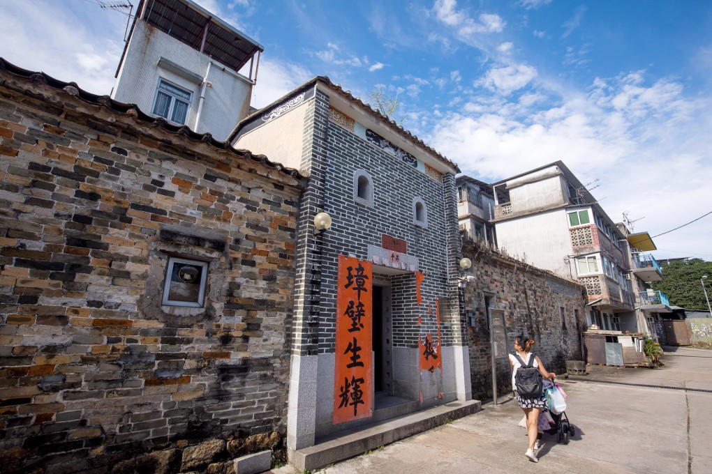 A woman pushes a buggy through the walled village of Sheung Cheung Wai in the Yuen Long district of the New Territories. From the attack on protesters and train passengers in Yuen Long station, it is evident that the villagers maintain a turf mentality that hasn’t changed much since the 19th century. Photo: Bloomberg
