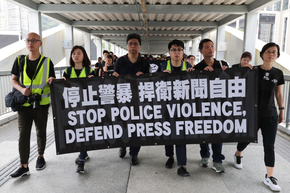 Thousands of Hong Kong journalists stage a silent march from Admiralty to the police headquarters in Wan Chai on July 14 against the police’s treatment of frontline reporters during the recent anti-extradition bill protests. Photo: Edmond So