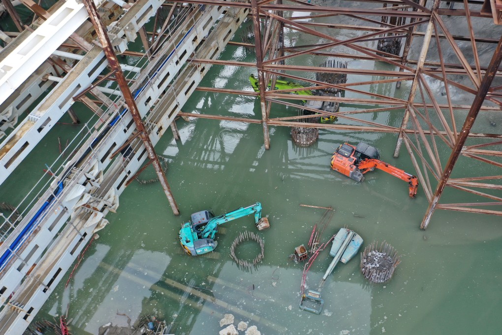 Construction equipment is submerged by flooding on Thursday at the building site of the West Kowloon Cultural District. Photo: Winson Wong