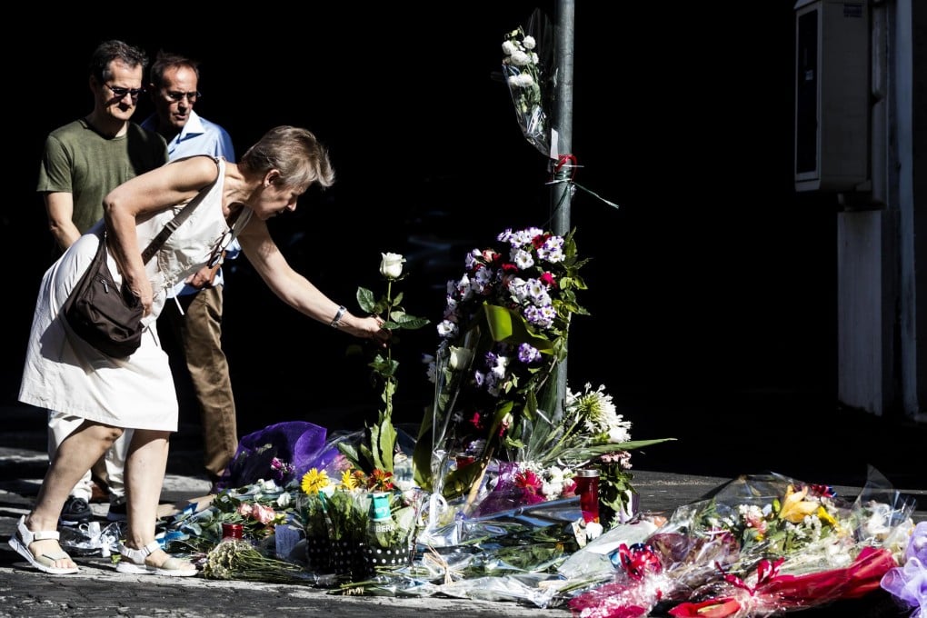 Flowers placed at the site, where a police officer was stabbed to death in Rome. Photo: EPA-EFE