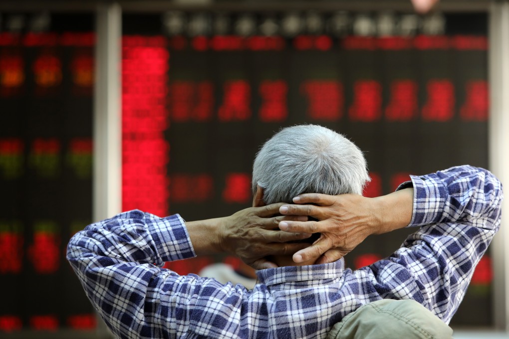 An investor monitors stock prices at a stock brokerage house in Beijing on November 16, 2018. Photo: Simon Song