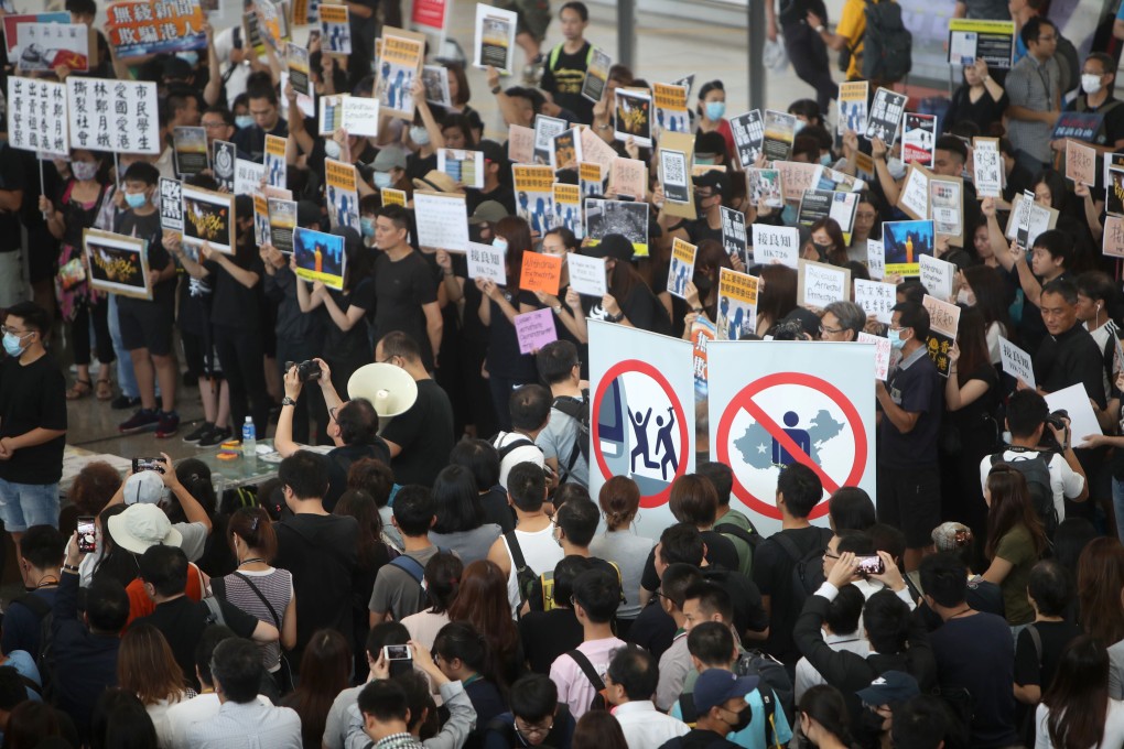 Airport workers and other protesters stage a sit-in at Hong Kong International Airport demanding the complete withdrawal of the divisive extradition bill. Photo: Winson Wong