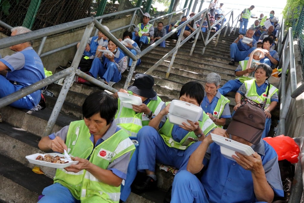 Cleaning workers on strike and having lunch on stairs in Kwun Tong. From professionals to blue-collar staff, Hong Kong’s overworking culture permeates all sectors. Photo: Felix Wong