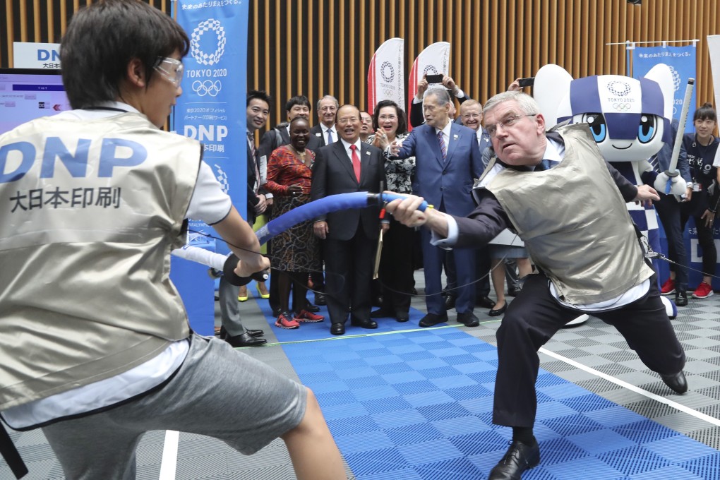 IOC president Thomas Bach shows off his fencing skills against a Japanese secondary school student in Tokyo this week. Photo: Xinhua