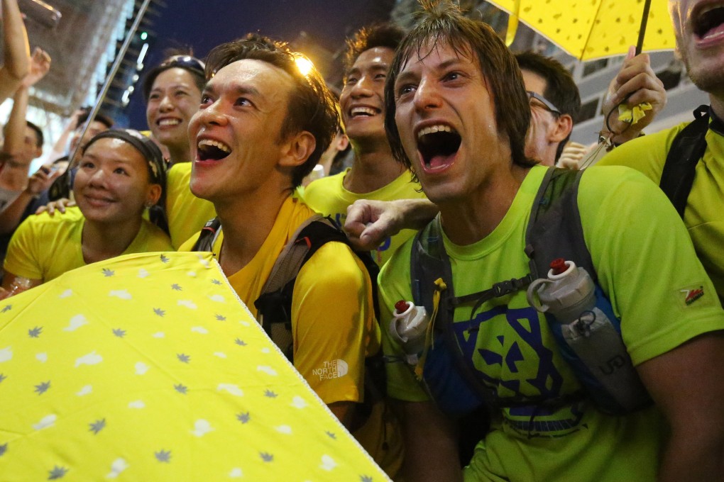 John Ellis (left) and Andrew Dawson arrive at Mong Kok as they run an ultramarathon to support pro-democracy protests in 2014. They have echoed that run for solidarity for the recent protests. Photo: K.Y. Cheng