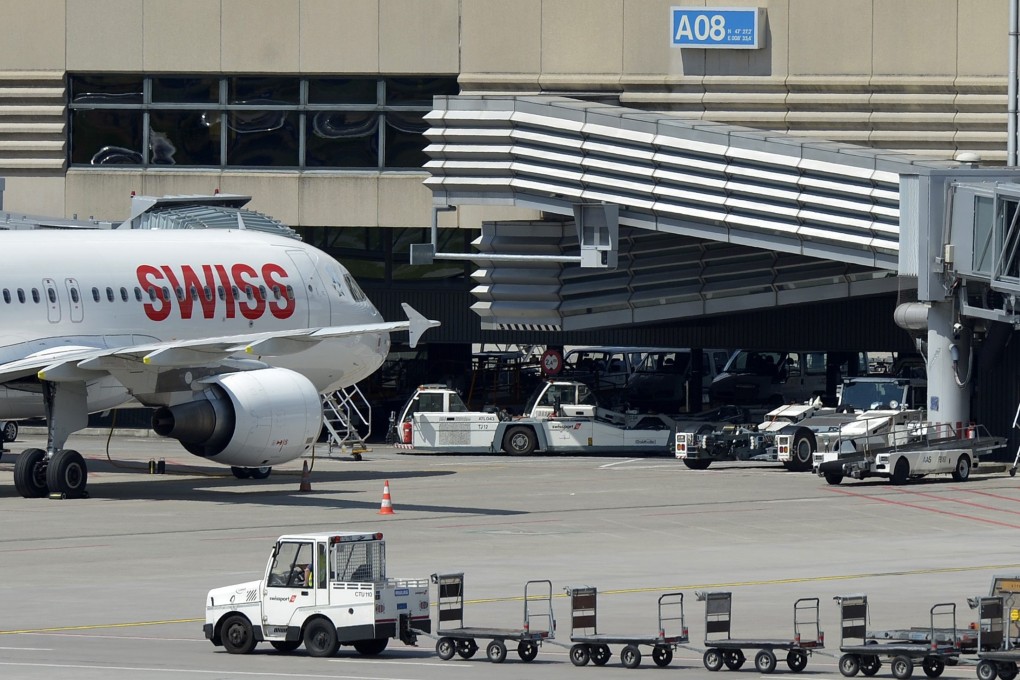 A Swissport baggage cart at Zurich airport. The Swiss luggage handler was bought by Chinese HNA Group for 2.73 billion Swiss frances (US2.81 billion US dollars. Photo: EPA
