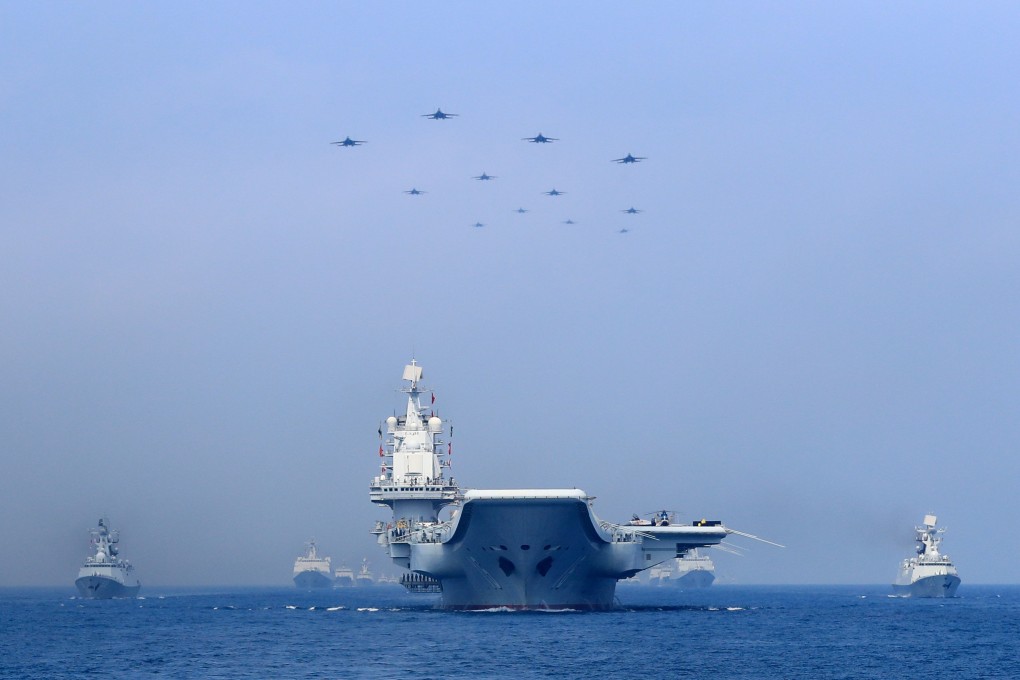 Chinese warships and fighter jets take part in a military display in the South China Sea. Photo: Reuters