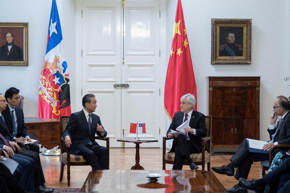 Chilean President Sebastian Pinera speaks with Chinese Foreign Minister Wang Yi (left) at the government house in Santiago, Chile, on Saturday. Photo: Reuters
