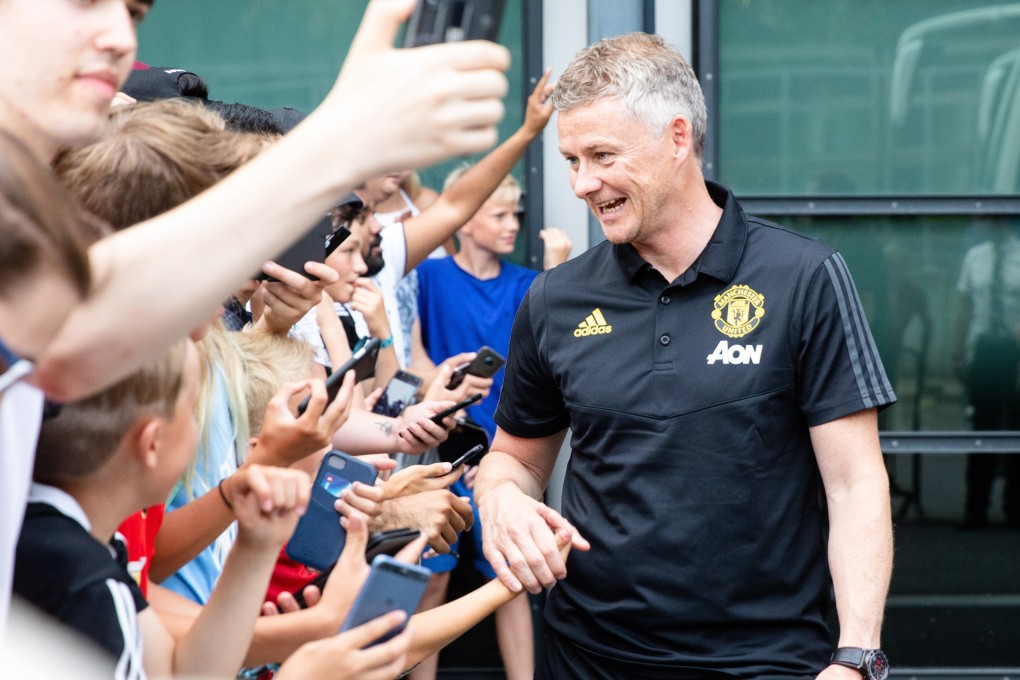 Manchester United manager Ole Gunnar Solskjaer greets fans after a training session in Oslo, Norway. Photo: EPA