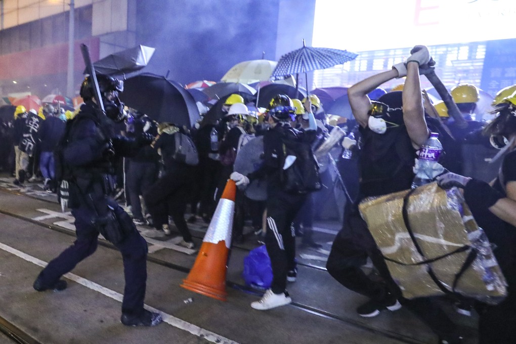 Police and protesters clash as crowds try to make their way towards Beijing’s liaison office in the city. Photo: Sam Tsang