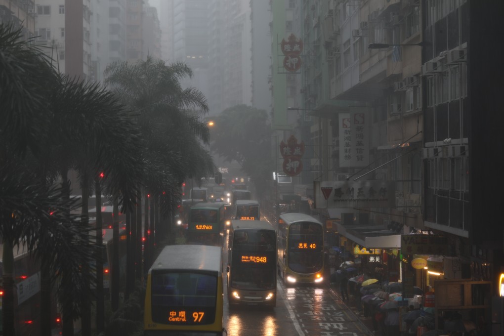 Buses slow in Wan Chai as Tropical Cyclone Wipha left Hong Kong drenched in rain. Photo: Tory Ho