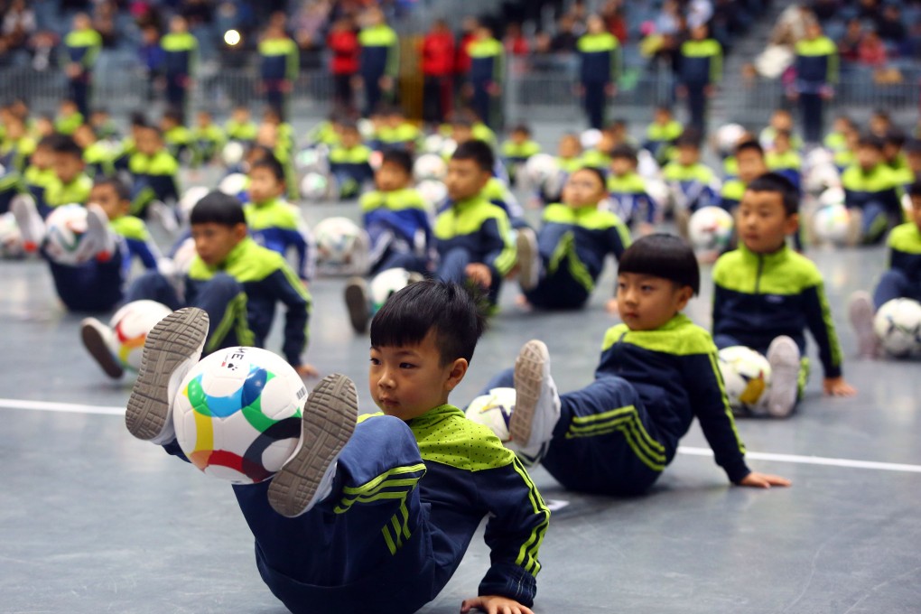 Children playing with their footballs at a gymnasium in Tianjin on December 16, 2017. Photo: Xinhua