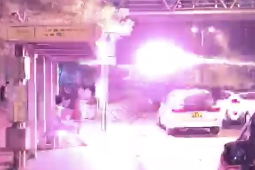 Fireworks were shot from a car at protesters outside Tin Shui Wai Police Station, seen in this video screen grab. Photo: SCMP Pictures