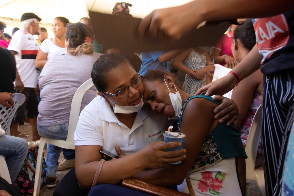 Relatives wait to enter the Legal Medical Institute to identify some of the bodies of the massacre which left 57 dead. Photo: EPA