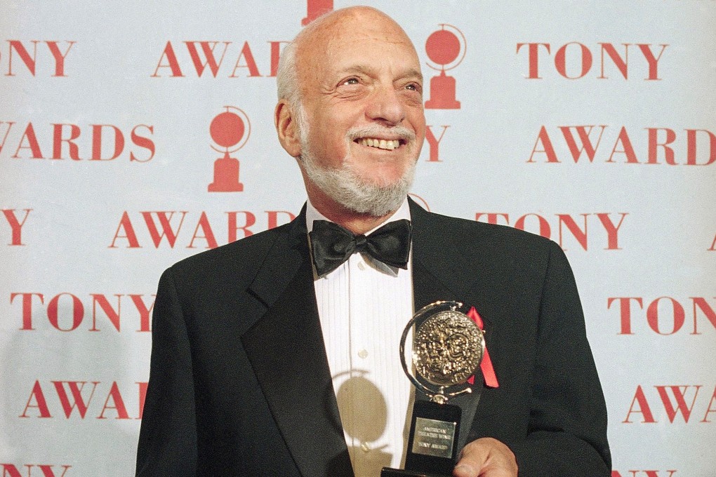 Hal Prince holds his Tony Award for best director in a musical for Show Boat at Broadway's Minskoff Theatre in New York in June 1995. Photo: AP