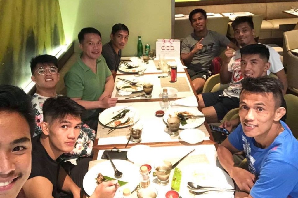 Team Lakay eat dinner together after Wednesday’s One Championship media day in Manila. Photo: Mark Sangiao/Facebook