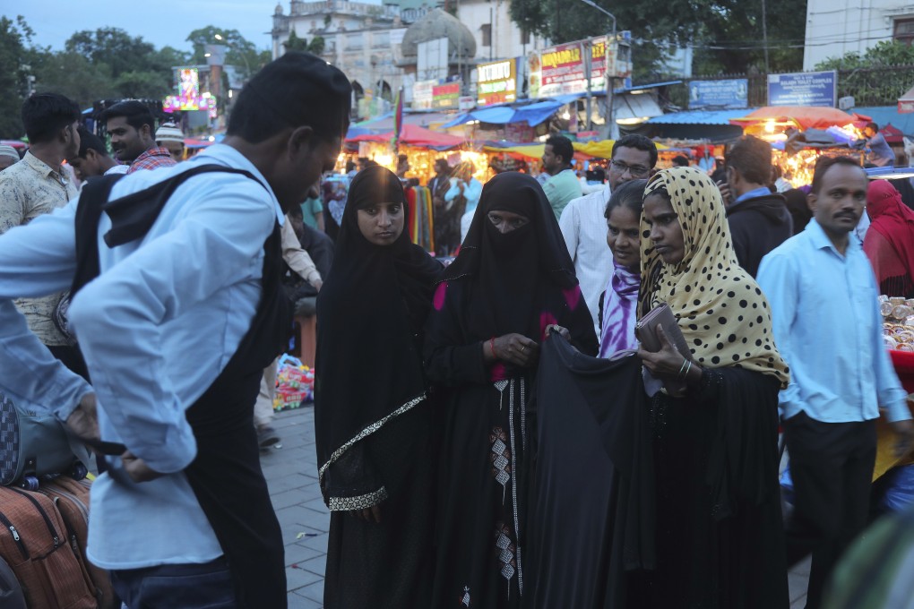 Indian Muslim women shop for hijabs in Hyderabad. Photo: AP