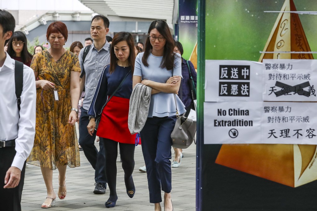 Government staff return to work at offices in Admiralty after a protest shuts down the area. Photo: Nora Tam