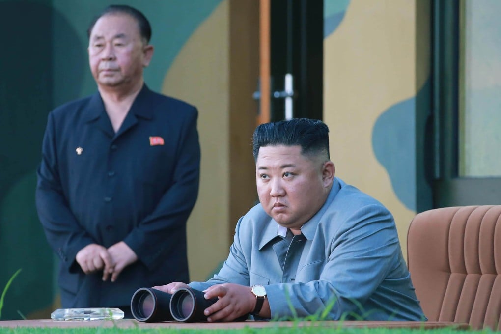A photo taken on Thursday and released on Friday shows North Korea's leader Kim Jong-un watching as a new type of short-range missile is launched at an undisclosed location in North Korea. Photo: KCNA via AFP