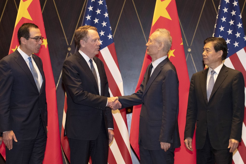 US Trade Representative Robert Lighthizer shakes hands with Chinese Vice Premier Liu He as US Treasury Secretary Steven Mnuchin looks on (left) with Chinese Commerce Minister Zhong Shan (right) in Shanghai. Photo: AP