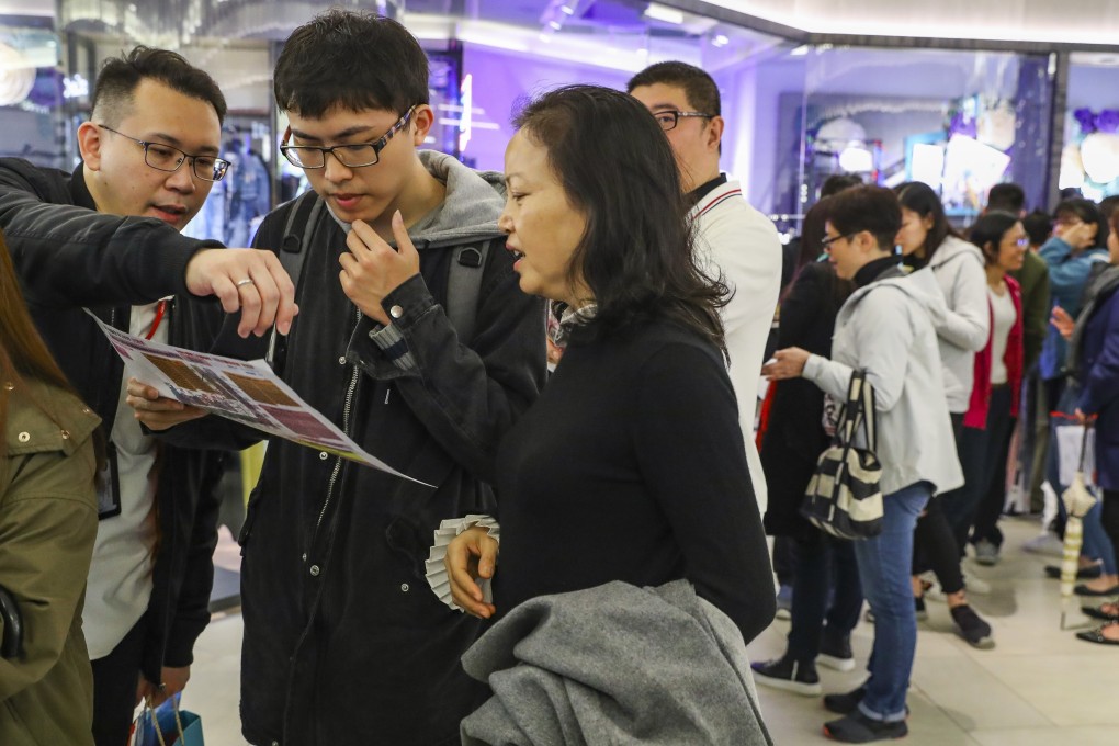 Potential homebuyers visit the showroom of the The Vantage, a Henderson Land Development, on March 9, 2019. Photo: Edmond So