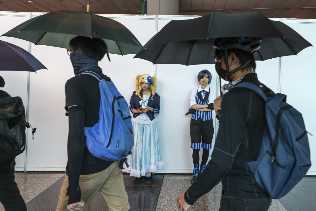 Trade show organisers are concerned that prolonged civil protests will put a damper on visitor numbers at upcoming events this autumn. Protesters at the convention centre in Wan Chai march during an animation, comics and games expo on July 28, 2019. Photo: Sam Tsang