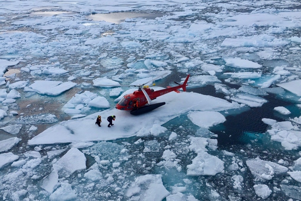 A helicopter from the Swedish icebreaker Oden lands on an ice floe to pick up crew members retrieving a data recorder on Arctic marine life movements, in the Canadian Arctic on July 25. Sweden is one of the eight members of the Arctic Council, whose mission is cooperation on environmental protection, sustainable development, and avoidance of military or strategic matters. Photo: Inner Space Centre via Reuters