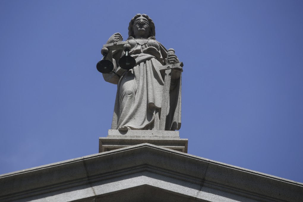 The sculpture representing justice atop the Court of Final Appeal building. Photo: Sam Tsang