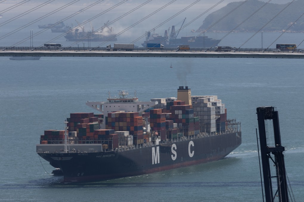 A container ship sails under the Stone Cutters Bridge on its way to the Kwai Tsing Container Terminal in Hong Kong on May 14, 2019. Current restrictions limit the height of cargo ships passing under the Tsing Ma Bridge to 53 metres. Photo: EPA