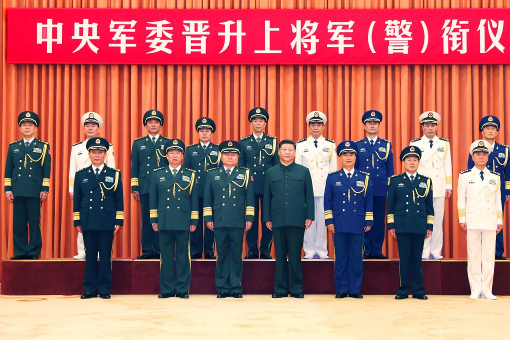 President Xi Jinping and other leaders pose for a group photo with 10 senior Chinese military and armed police officers promoted to general in Beijing on Wednesday. Photo: Xinhua