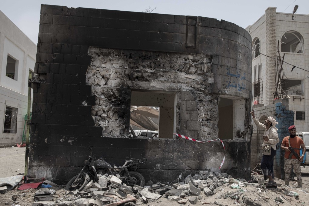 Security forces inspect the site of a deadly attack in Aden, Yemen, on Thursday. Photo: AP