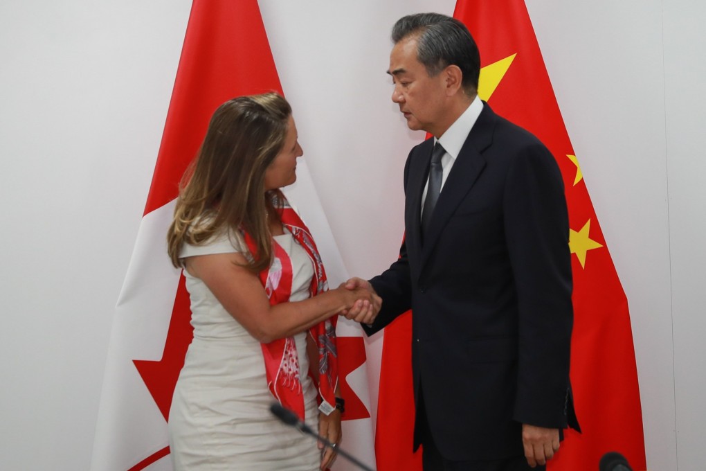 Canadian Foreign Minister Chrystia Freeland greets Chinese counterpart Wang Yi in Bangkok on Friday, their first meeting since the countries’ relations soured in December. Photo: Xinhua
