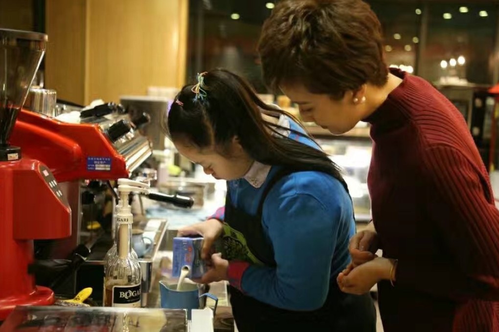 A barista makes coffee at Wisdom Tree’s flagship store in Hangzhou, Zhejiang province. Photo: Handout