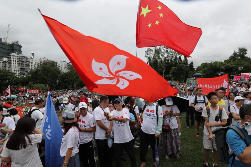 Flag-waving police supporters at Saturday’s Causeway Bay rally. Photo: Edward Wong
