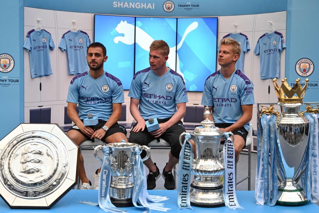 Manchester City’s Bernardo Silva, Kevin De Bruyne, and Oleksandr Zinchenko look on during a promotional event in Shanghai. Photo: AFP
